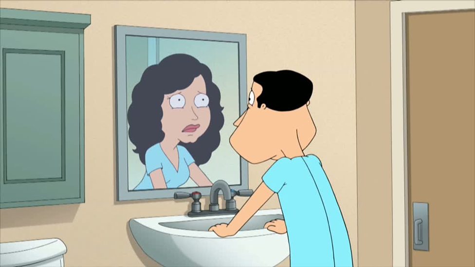 Glen Quagmire stands in front of mirror, horrified to see a woman in his reflection.